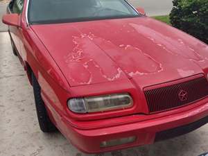 Red 1995 Chrysler Le Baron