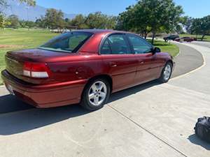 Red 2000 Cadillac Catera