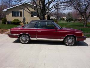 Red 1986 Chrysler Le Baron