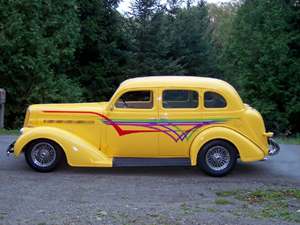 Yellow 1936 Dodge four door sedan