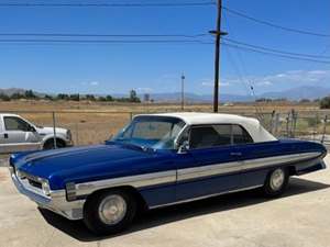 Blue 1961 Oldsmobile Starfire