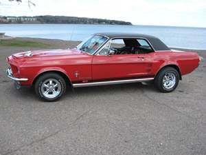 Red 1967 Ford Mustang GT custom coupe