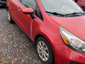 Red 2013 Kia RIO