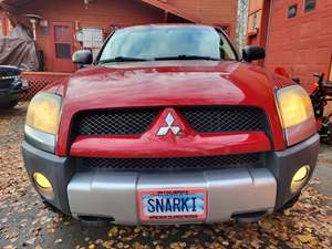 Red 2006 Mitsubishi Raider