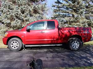 Red 2004 Nissan Titan LE