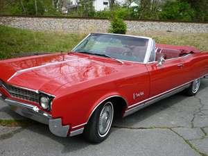 Red 1966 Oldsmobile Ninety-Eight