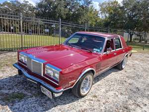Red 1987 Chrysler New Yorker