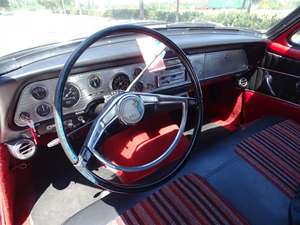 Red 1957 Studebaker Hawk